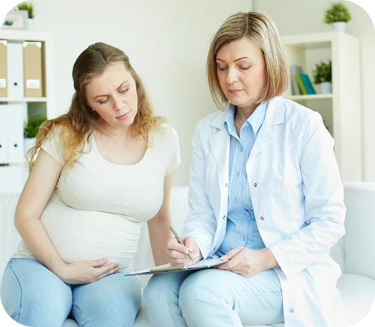 Expectant mother receiving prenatal guidance